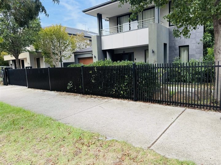 Black steel fence outside a residential property