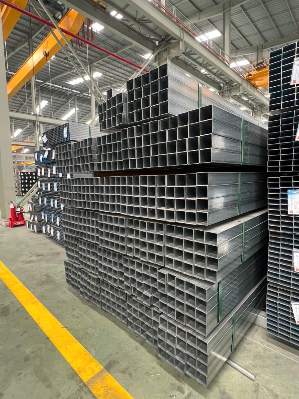 Vertical steel tube stock in warehouse